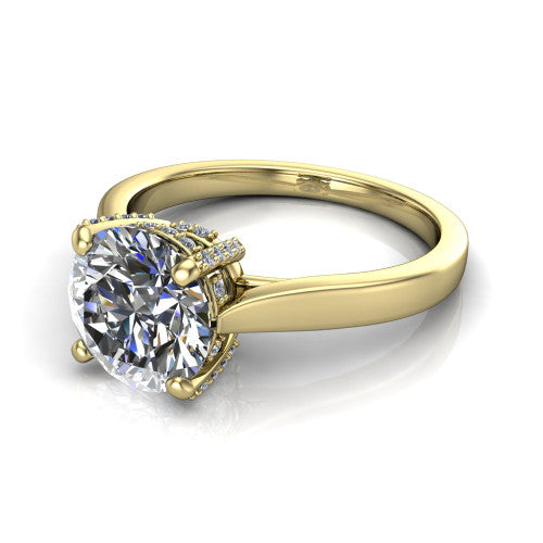 Finley round classic engagement ring in 18K Yellow Gold, three-quarter perspective showing the round center diamond in a four-prong head with a hidden halo