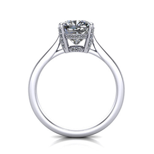 Finley cushion classic engagement ring in Platinum, through-finger front profile showing the hidden halo beneath the basket from the front