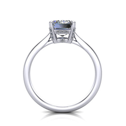 Finley emerald-cut classic engagement ring in 18K White Gold, through-finger front profile showing the hidden halo beneath the basket from the front