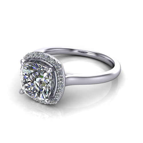 Dream cushion halo engagement ring in Platinum, three-quarter perspective showing the cushion center diamond in a pave halo with a leaf-inspired gallery