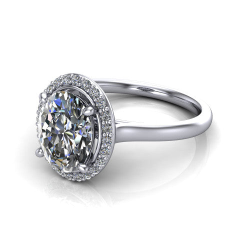Dream oval halo engagement ring in 14K White Gold, three-quarter perspective showing the oval center diamond in a pave halo with a leaf-inspired gallery