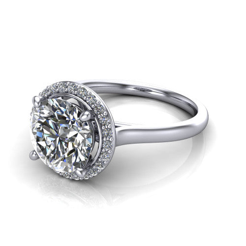 Andrea round halo engagement ring in Platinum, three-quarter perspective showing the round center diamond in a pave halo above a thin band
