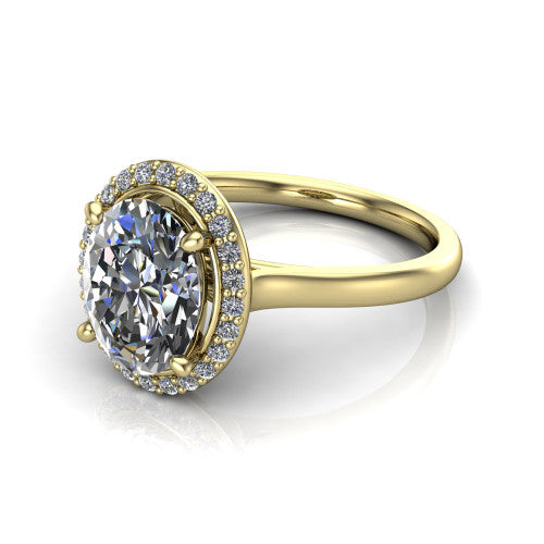 Dream oval halo engagement ring in 18K Yellow Gold, three-quarter perspective showing the oval center diamond in a pave halo with a leaf-inspired gallery