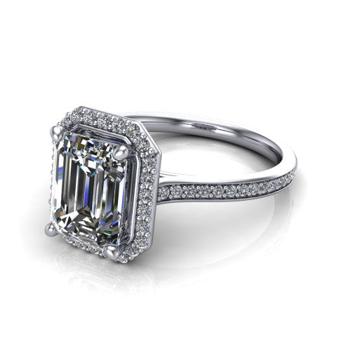 Delaney emerald halo engagement ring in 18K White Gold, three-quarter perspective showing the emerald center diamond in a pave halo above a pave band