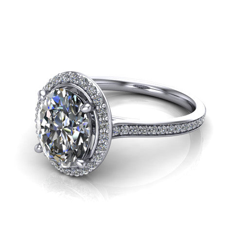 Delaney oval halo engagement ring in Platinum, three-quarter perspective showing the oval center diamond in a pave halo above a pave band