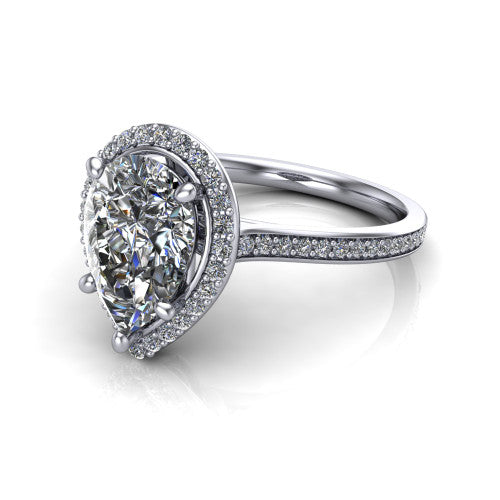 Delaney pear halo engagement ring in 18K White Gold, three-quarter perspective showing the pear center diamond in a pave halo above a pave band