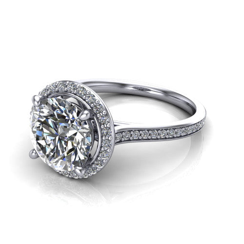 Delaney round halo engagement ring in Platinum, three-quarter perspective showing the round center diamond in a pave halo above a pave band