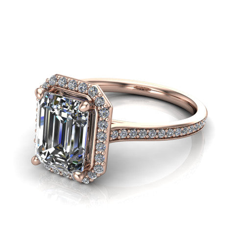 Delaney emerald halo engagement ring in 18K Rose Gold, three-quarter perspective showing the emerald center diamond in a pave halo above a pave band