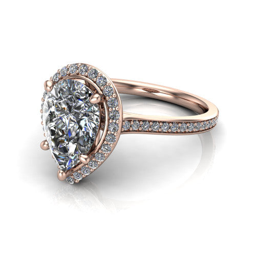 Delaney pear halo engagement ring in 18K Rose Gold, three-quarter perspective showing the pear center diamond in a pave halo above a pave band