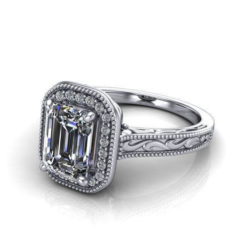Octavia emerald vintage halo engagement ring in 18K White Gold, three-quarter perspective showing the emerald center diamond in a milgrain halo above an engraved band