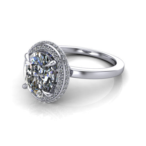 Angela oval halo engagement ring in 18K White Gold, three-quarter perspective showing the oval center diamond in a double-row pave halo
