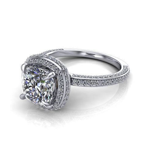 Malia cushion halo engagement ring in Platinum, three-quarter perspective showing the cushion center diamond in a pave halo above a pave band
