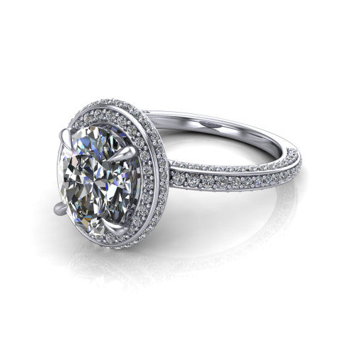 Malia oval halo engagement ring in Platinum, three-quarter perspective showing the oval center diamond in a pave halo above a pave band