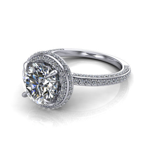 Malia round halo engagement ring in Platinum, three-quarter perspective showing the round center diamond in a pave halo above a pave band