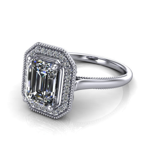 Lilly emerald-cut halo engagement ring in 18K White Gold, three-quarter perspective showing the emerald-cut center diamond in a milgrain pave halo above a milgrain band