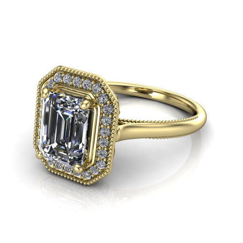 Lilly emerald-cut halo engagement ring in 14K Yellow Gold, three-quarter perspective showing the emerald-cut center diamond in a milgrain pave halo above a milgrain band