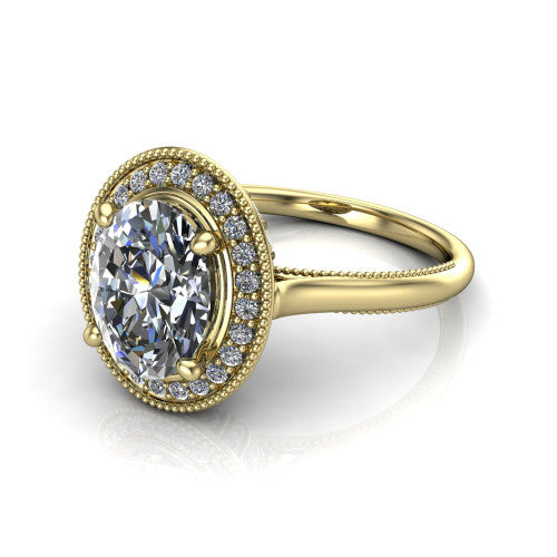 Lilly oval halo engagement ring in 18K Yellow Gold, three-quarter perspective showing the oval center diamond in a milgrain pave halo above a milgrain band