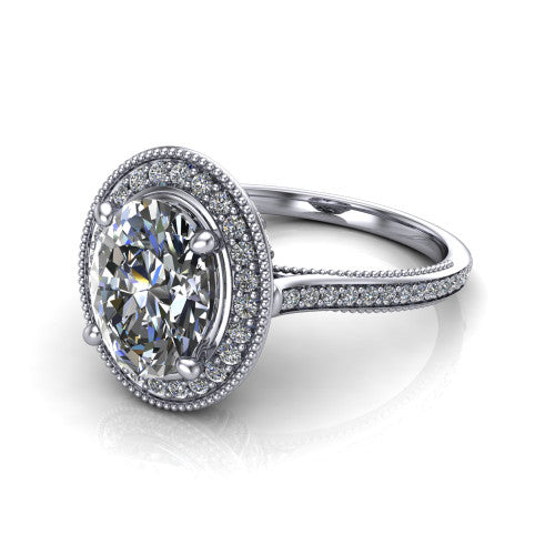 Diana oval halo engagement ring in 18K White Gold, three-quarter perspective showing the oval center diamond in a milgrain pave halo above a pave band