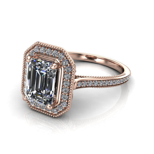 Diana emerald-cut halo engagement ring in 14K Rose Gold, three-quarter perspective showing the emerald-cut center diamond in a milgrain pave halo above a pave band