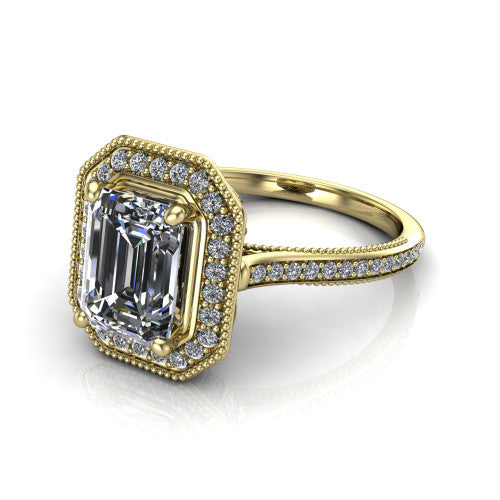 Diana emerald-cut halo engagement ring in 14K Yellow Gold, three-quarter perspective showing the emerald-cut center diamond in a milgrain pave halo above a pave band