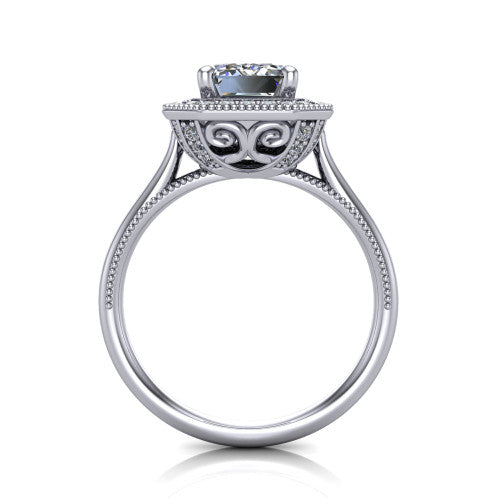 Diana emerald-cut halo engagement ring in Platinum, through-finger front profile showing the filigree gallery and halo from the front