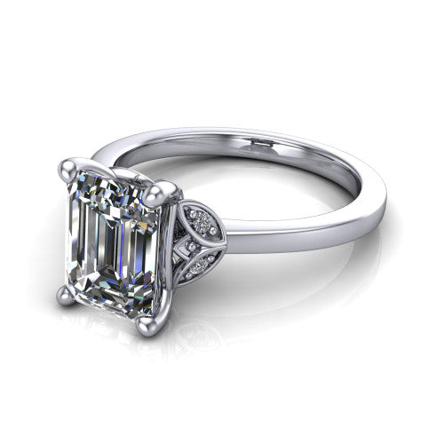Lola emerald solitaire engagement ring in 18K White Gold, three-quarter perspective showing the emerald center diamond above a polished band