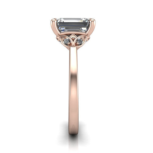 Lola emerald solitaire engagement ring in 18K Rose Gold, side profile showing the petal basket and polished band