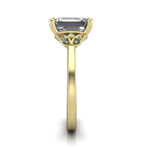 Lola emerald solitaire engagement ring in 14K Yellow Gold, side profile showing the petal basket and polished band