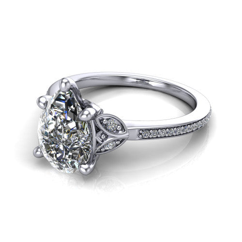 Lena pear solitaire engagement ring in 18K White Gold, three-quarter perspective showing the pear center diamond above a pave band
