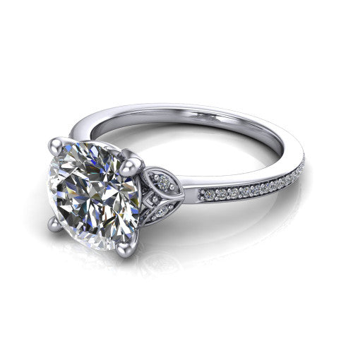 Lena round solitaire engagement ring in Platinum, three-quarter perspective showing the round center diamond above a pave band