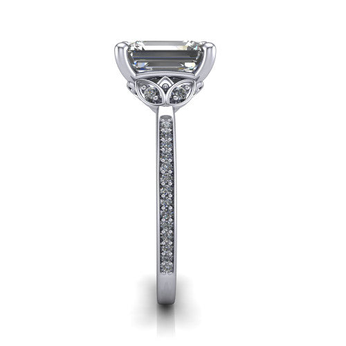 Lena emerald solitaire engagement ring in 18K White Gold, side profile showing the petal basket and pave band