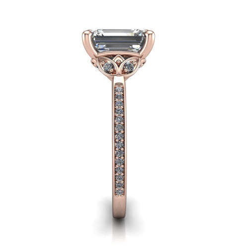 Lena emerald solitaire engagement ring in 14K Rose Gold, side profile showing the petal basket and pave band
