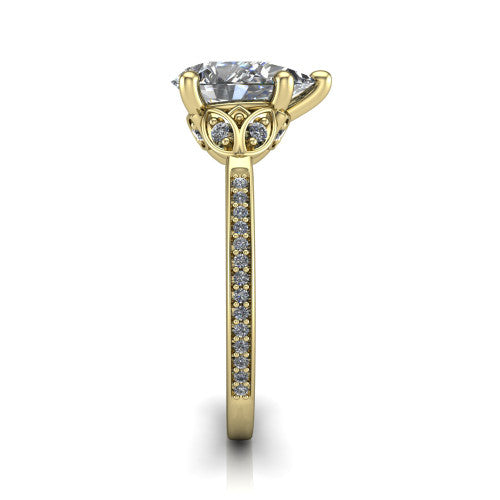 Lena pear solitaire engagement ring in 14K Yellow Gold, side profile showing the petal basket and pave band