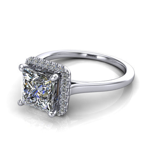 Dakota princess halo engagement ring in Platinum, three-quarter perspective showing the princess center diamond in a pave halo above a polished band