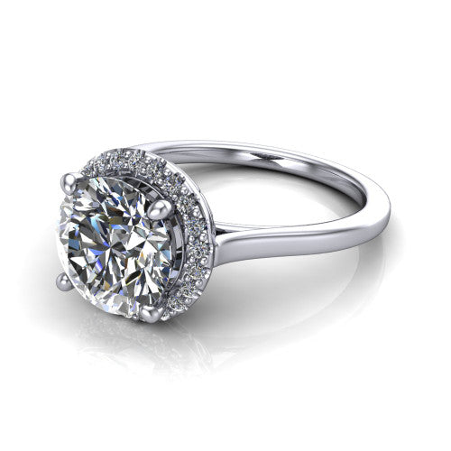 Dakota round halo engagement ring in Platinum, three-quarter perspective showing the round center diamond in a pave halo above a polished band