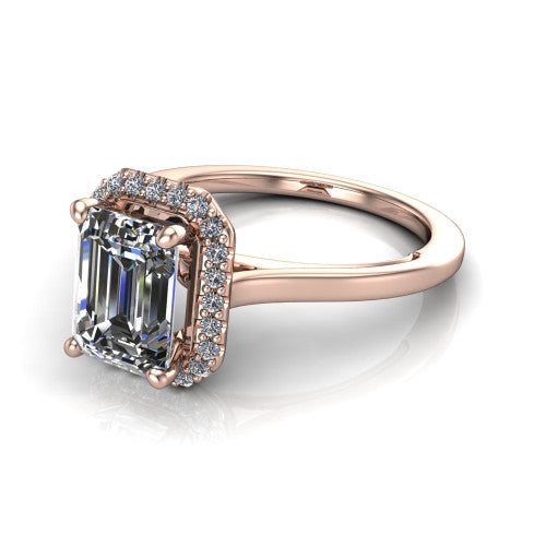 Makenzie emerald halo engagement ring in 18K Rose Gold, three-quarter perspective showing the emerald center diamond in a pave halo on a thin polished band