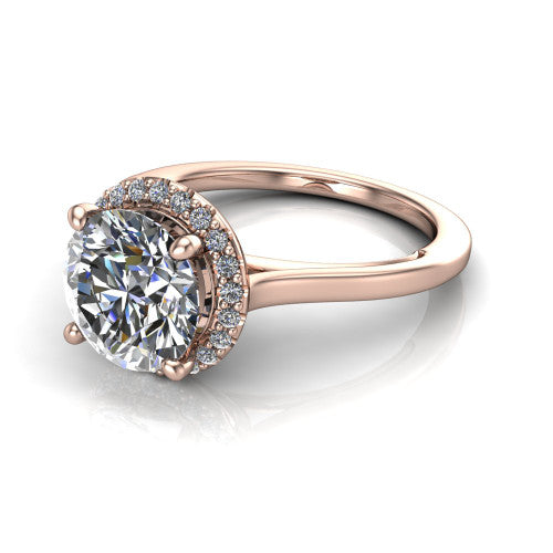 Makenzie round halo engagement ring in 18K Rose Gold, three-quarter perspective showing the round center diamond in a pave halo on a thin polished band