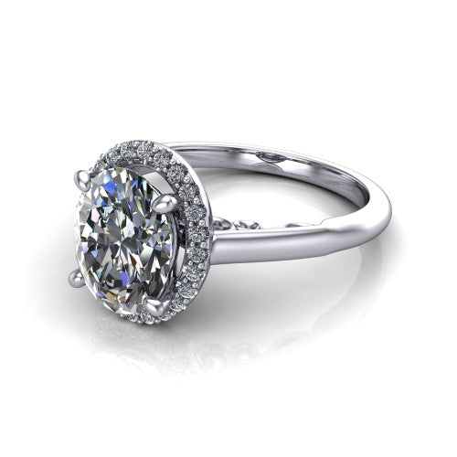 Paige oval halo engagement ring in 18K White Gold, three-quarter perspective showing the oval center diamond in a pave halo above a polished band