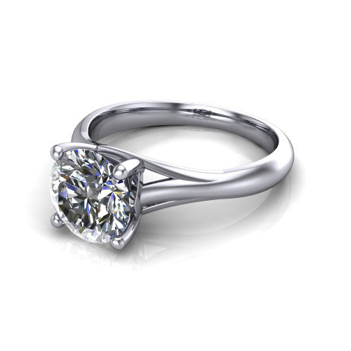 Francesca round solitaire engagement ring in Platinum, three-quarter perspective showing the round center diamond, double-claw prongs, and split shank