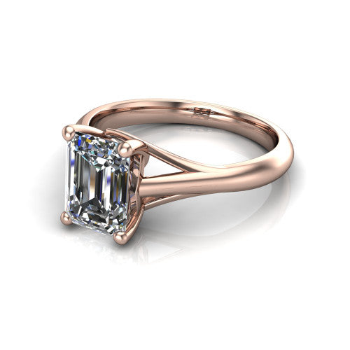 Francesca emerald-cut solitaire engagement ring in 14K Rose Gold, three-quarter perspective showing the emerald-cut center diamond, double-claw prongs, and split shank