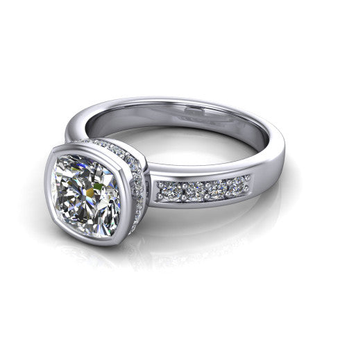 Astrid cushion-cut hidden halo engagement ring in Platinum, three-quarter perspective showing the bezel-set cushion-cut center diamond, hidden halo, and pavé band