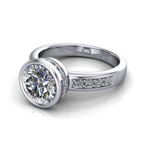 Astrid round hidden halo engagement ring in Platinum, three-quarter perspective showing the bezel-set round center diamond, hidden halo, and pavé band