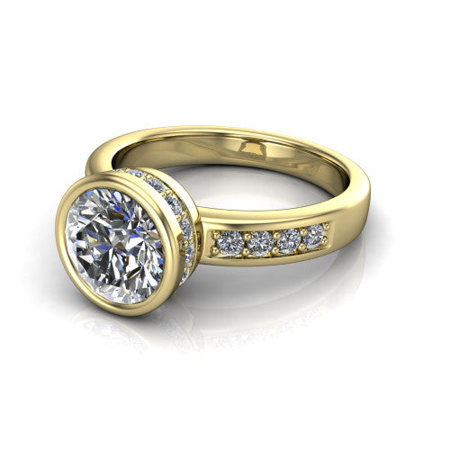 Astrid round hidden halo engagement ring in 18K Yellow Gold, three-quarter perspective showing the bezel-set round center diamond, hidden halo, and pavé band