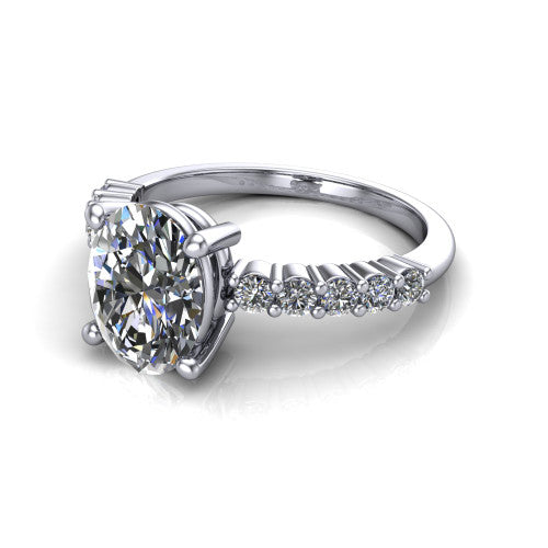 Fernanda oval solitaire engagement ring in Platinum, three-quarter perspective showing the oval center diamond, 4-prong setting, and shared-prong pave band