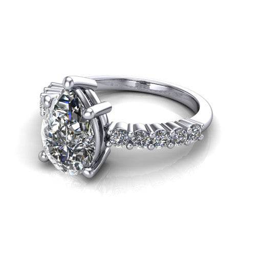 Fernanda pear solitaire engagement ring in Platinum, three-quarter perspective showing the pear center diamond, 4-prong setting, and shared-prong pave band