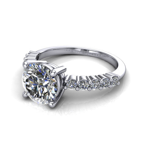 Fernanda round solitaire engagement ring in 14K White Gold, three-quarter perspective showing the round center diamond, 4-prong setting, and shared-prong pave band
