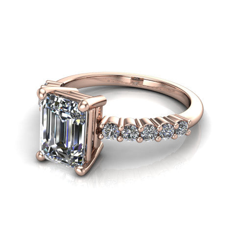 Fernanda emerald solitaire engagement ring in 18K Rose Gold, three-quarter perspective showing the emerald center diamond, 4-prong setting, and shared-prong pave band