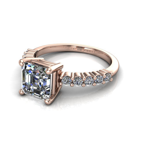 Fernanda square emerald solitaire engagement ring in 18K Rose Gold, three-quarter perspective showing the square emerald center diamond, 4-prong setting, and shared-prong pave band
