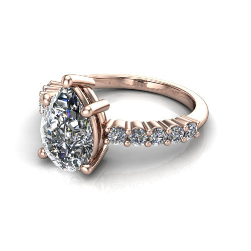 Fernanda pear solitaire engagement ring in 18K Rose Gold, three-quarter perspective showing the pear center diamond, 4-prong setting, and shared-prong pave band