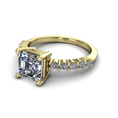 Fernanda square emerald solitaire engagement ring in 18K Yellow Gold, three-quarter perspective showing the square emerald center diamond, 4-prong setting, and shared-prong pave band